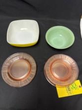 Pink Depression glass plates, jadeite bowl, yellow Pyrex bowl