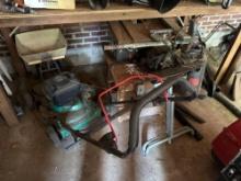 shop vac, early table saw, push mower, spreader, ridgid work support
