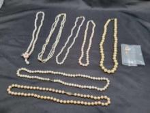 7 Pearl necklaces and 2 pairs of earrings