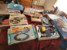 Large lot of slot cars, track, boxes, HO train items