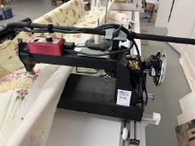 Long reach commercial quilt sewing machine and table.