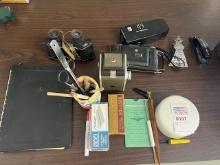 old cameras and binoculars with  oddities