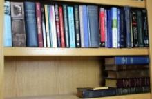 Shelf Filled with Books on Christianity and Bibles